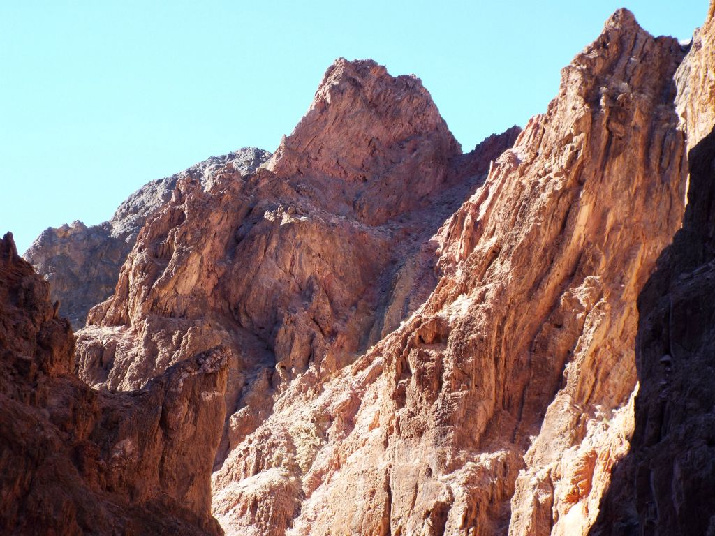 Small jagged peaks high above lower Red Wall Canyon: