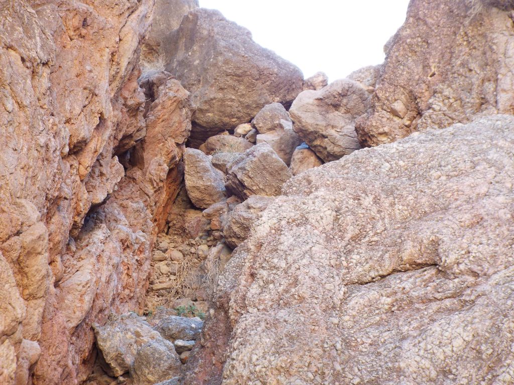 This zoomed in view shows a clearer view of what the solid rock shelf and shelf of boulders looks like.  The boulders appear to be secure for the moment but caution is necessary when climbing down this area.  If one boulder broke loose, they could all come down like giant bowling balls: