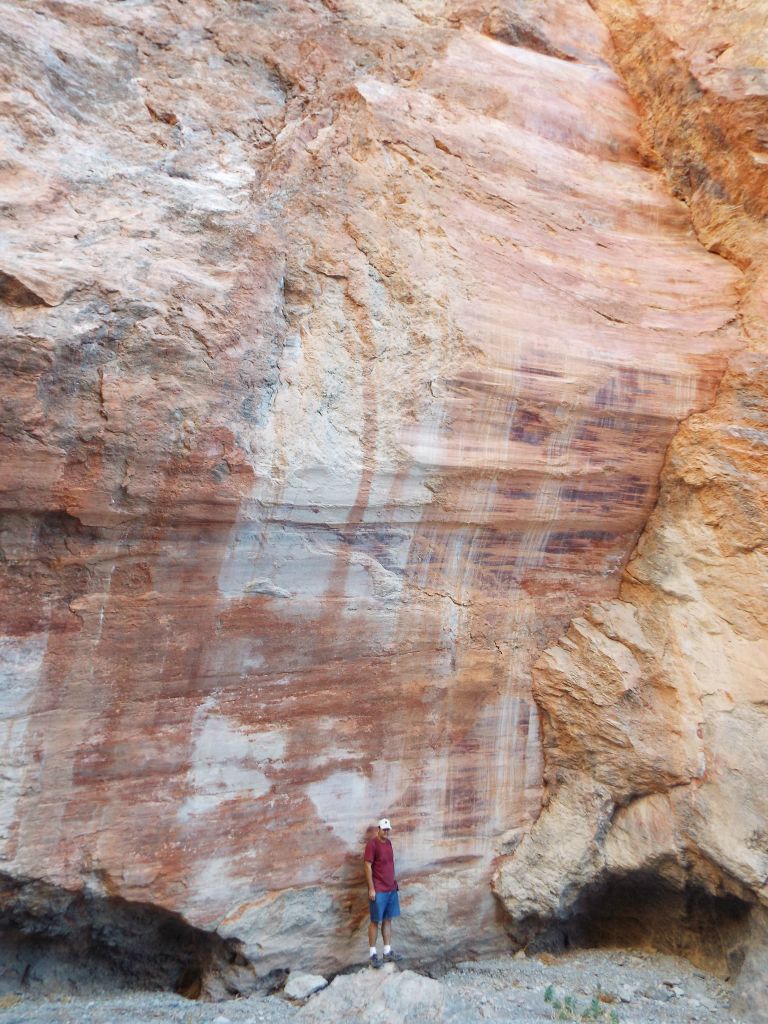 A picture of Steve standing at the base of the slickenside: