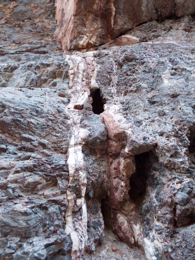There were veins of various rock types mixed in with the solid canyon wall: