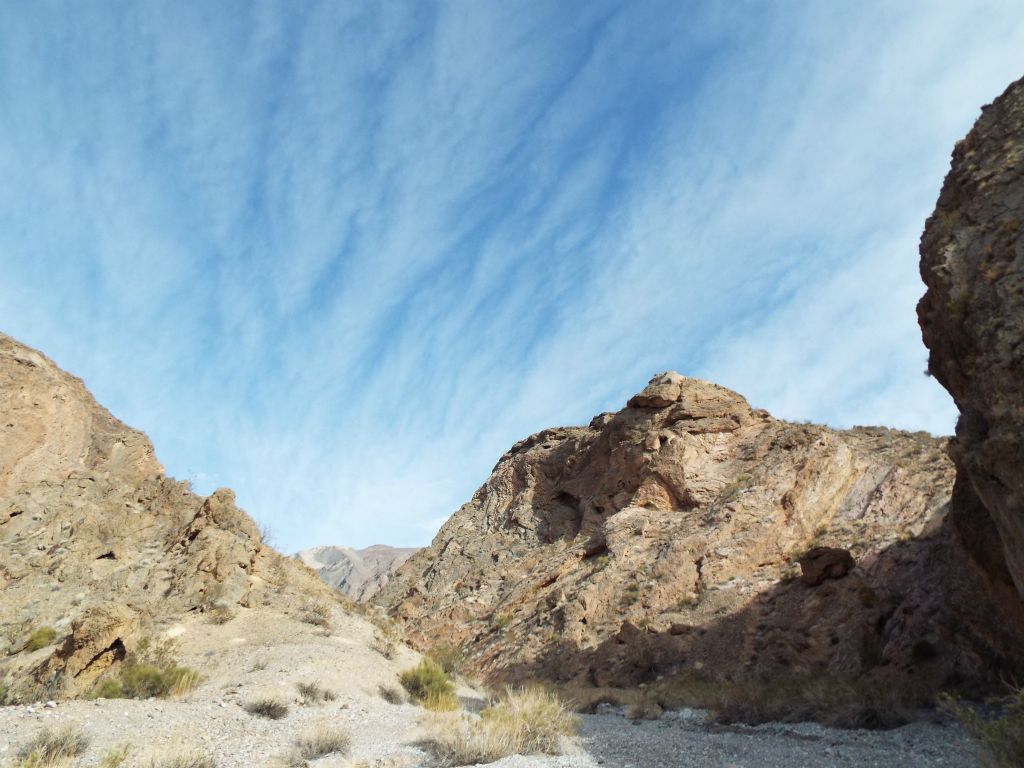 Admiring the blue sky and white clouds high above Red Wall Canyon: