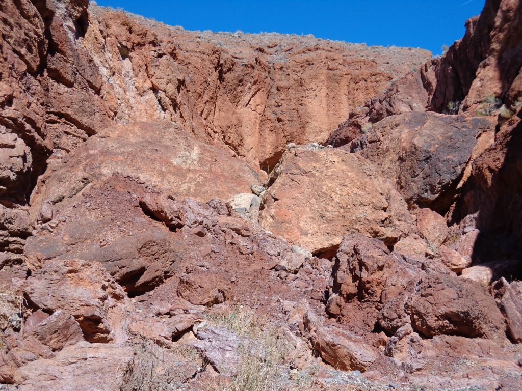 Notice the large amount of huge boulders which have fallen into the wash: