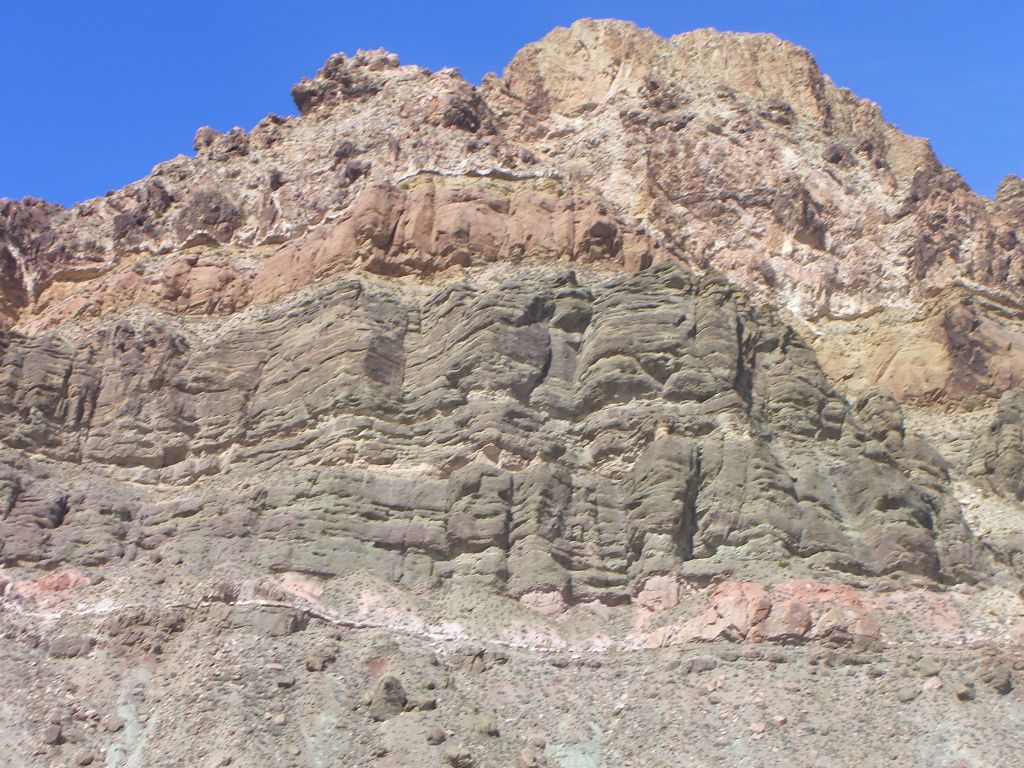 Check out the beautiful colored layers of rock on the minor peak above Red Pass: