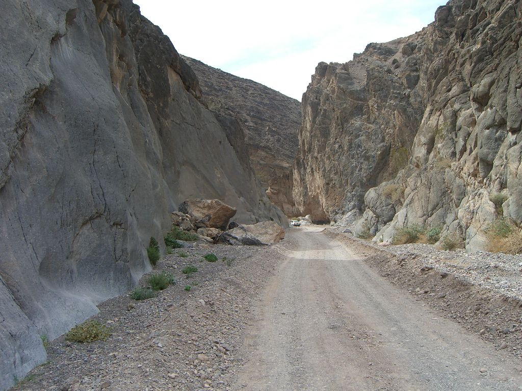 A contrast between the two sides of the canyon walls, with the left being smooth and polished and the right being more bulgy: