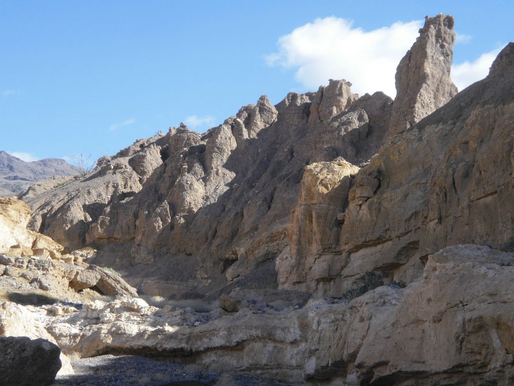 Passing by some majestic rock pillars up on the canyon wall: