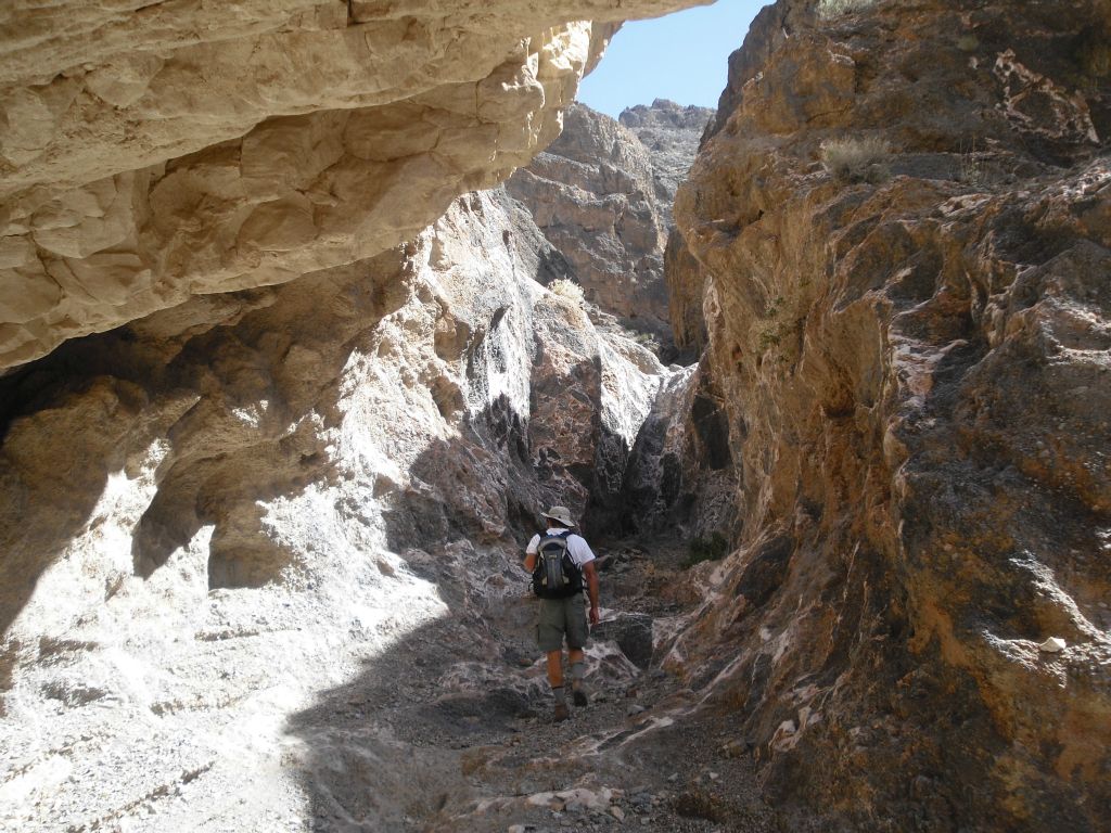 Charlie heading up the canyon as he passes under an overhang:
