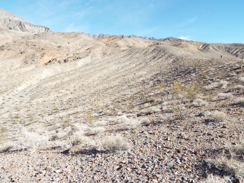 After attaining the first small ridge, we began walking along it and overlooking Upper Red Wall Canyon: