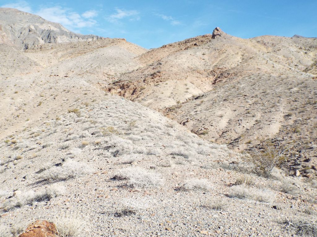 Walking along the ridge and angling toward crossover rock, seen here in the distance: