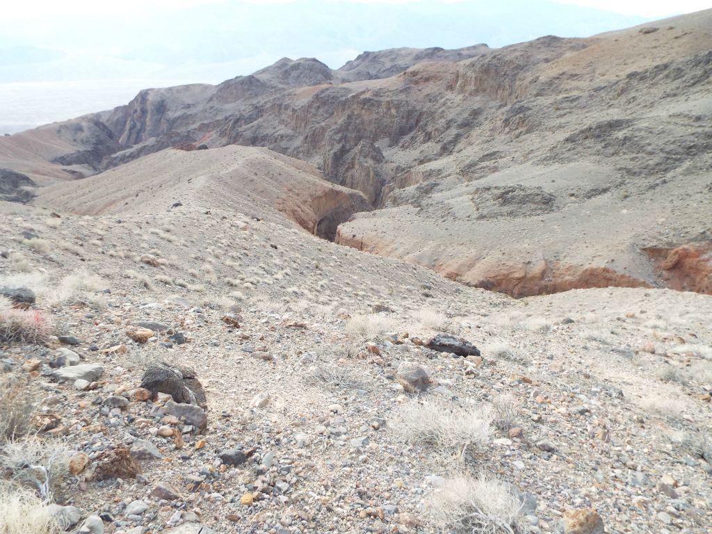 We finally got onto the main ridge above the canyon and began following that.  As you can see, there is no place visible anywhere in the distance which would allow us to get back into the canyon: