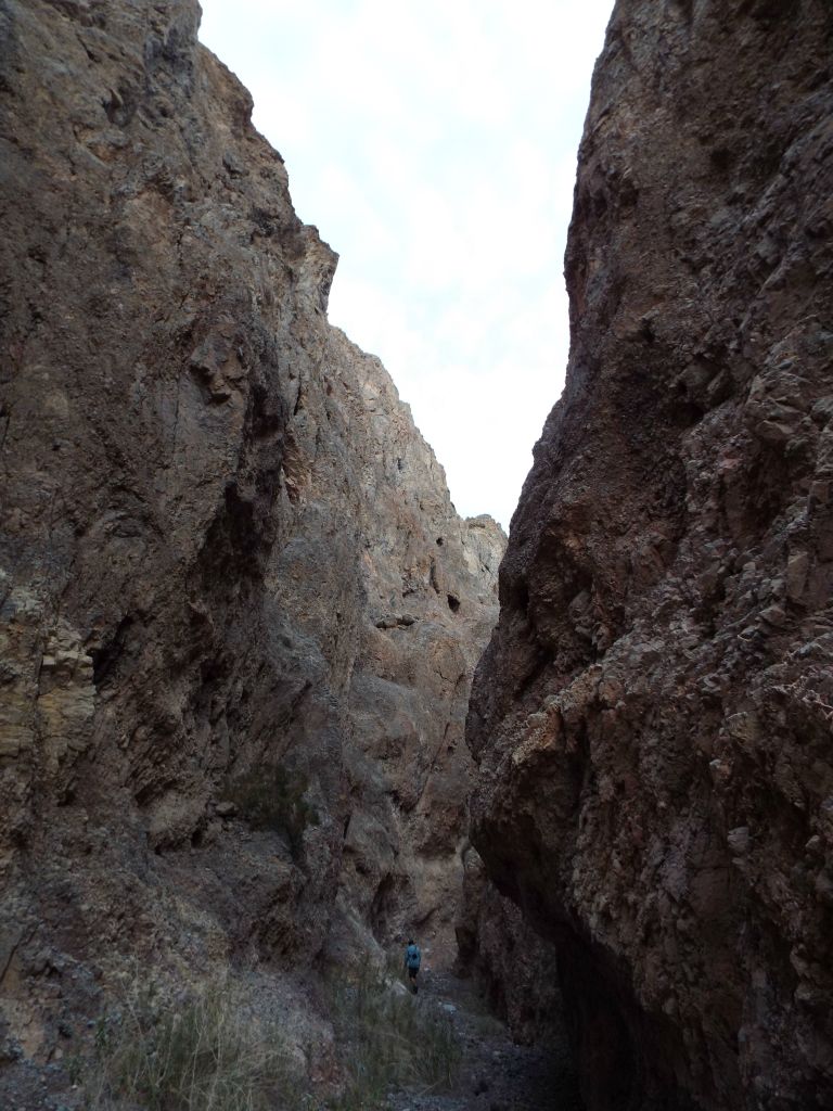 Charlie can once again be seen up ahead looking very small in comparison to the high walls: