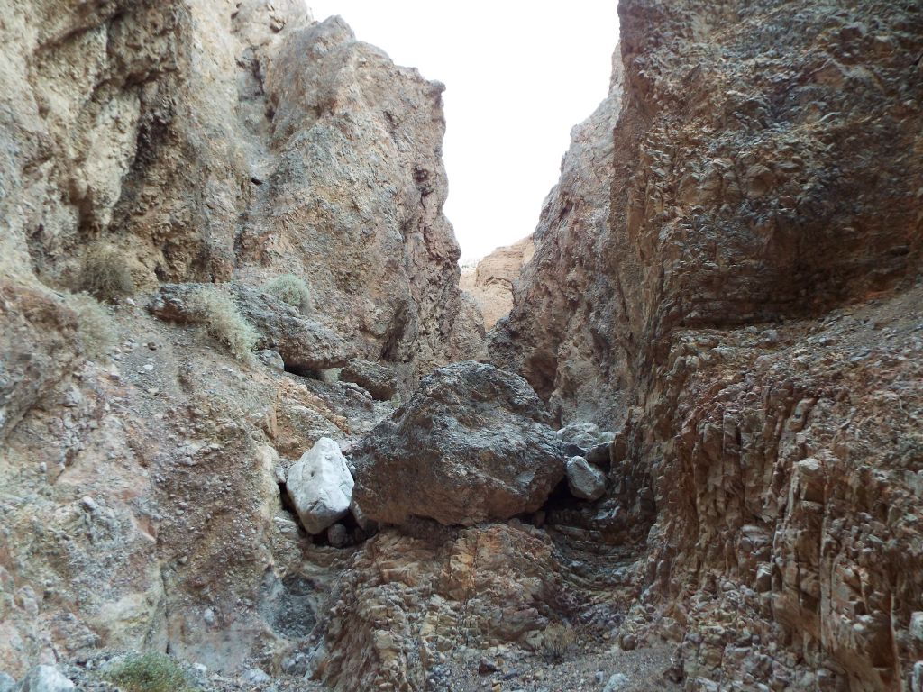 A massive boulder has rolled into the center of the canyon and created a double dry fall: