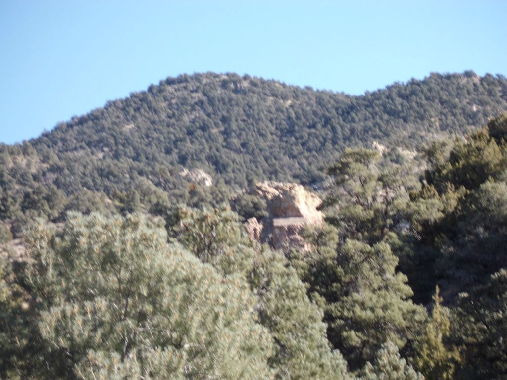 Throne Rock can be seen a few minutes later.  It looks like a stone chair that a giant walking by would sit down in.  Use Throne Rock (a bit blurry in the center of this picture) to find your way back to this point: