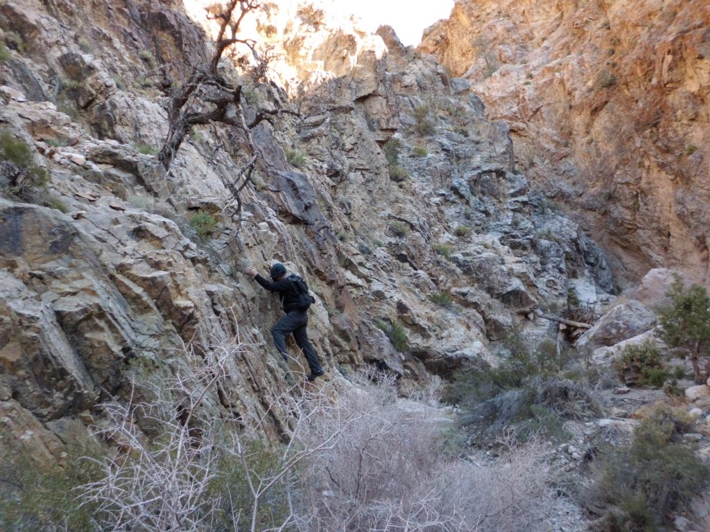 Tobin climbing down off of the bypass and dropping to the canyon floor.  I chose a little bit easier of a route, which didn't involve any climbing, just extreme caution: