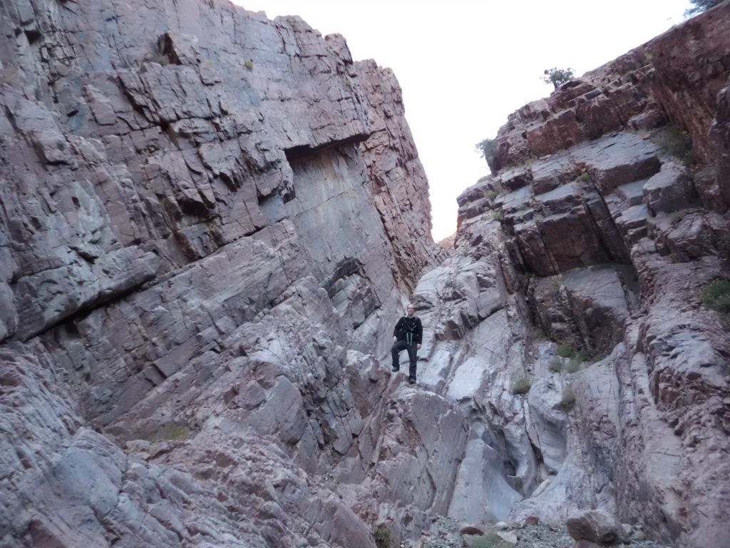 Tobin standing on a rock in this amazing section of canyon with unique rock shapes: