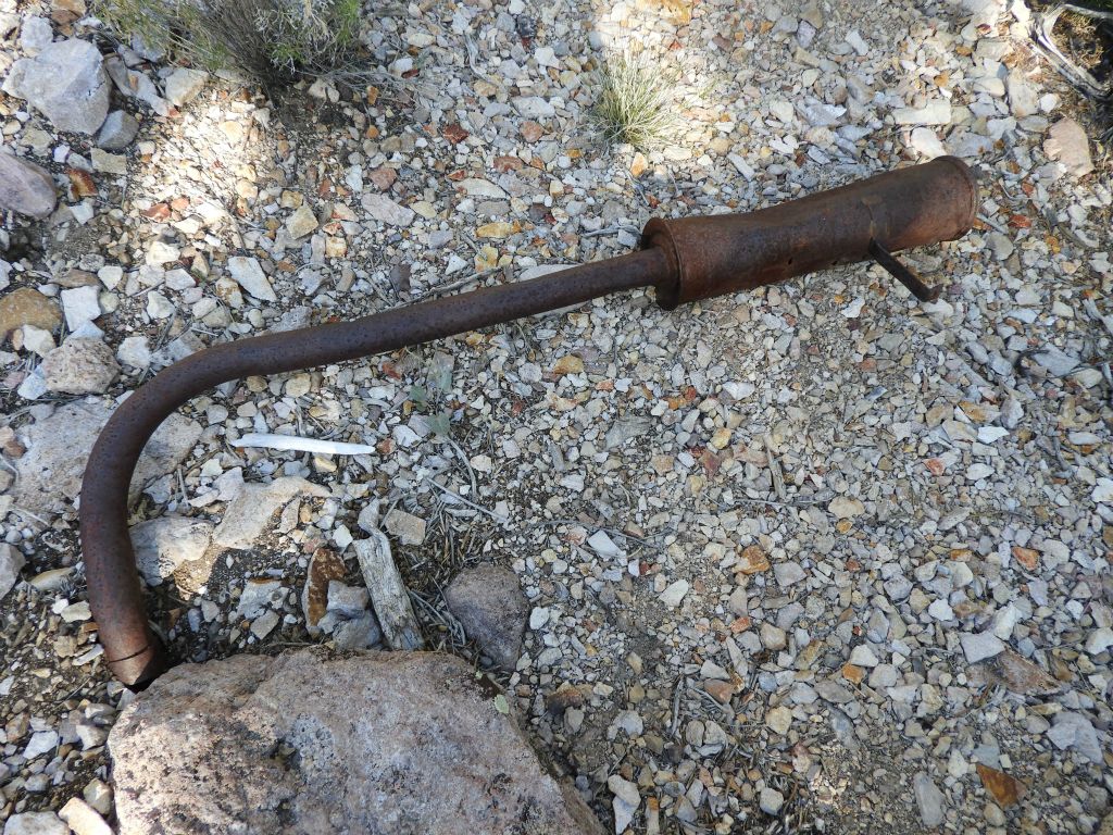 This looks like an old car muffler found down in the wash: