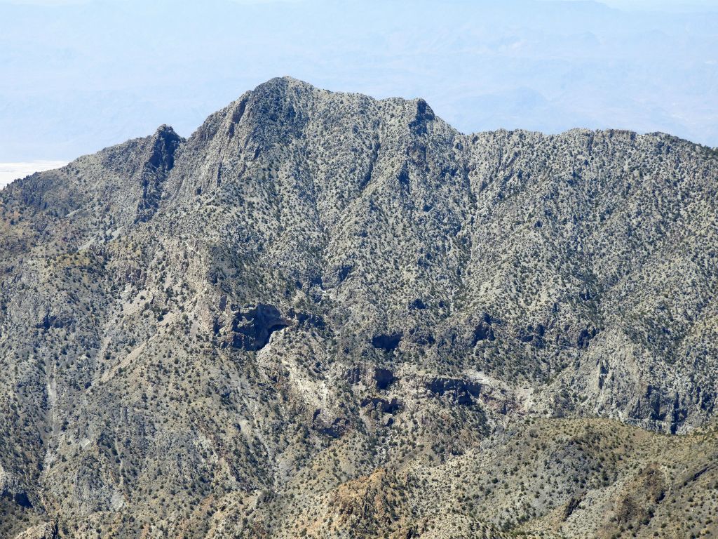 Notice that there appears to be an inaccessible cave about halfway down the mountain beneath the summit of Mount Palmer:
