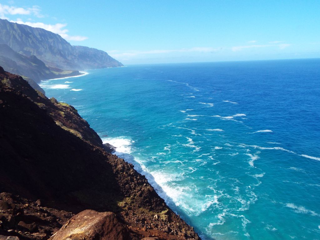 At this spot, I could finally see my end destination for the first time far in the distance.  The rocky section of Kalalau Beach starts just past the low circular land outcropping in the left middle of the picture: