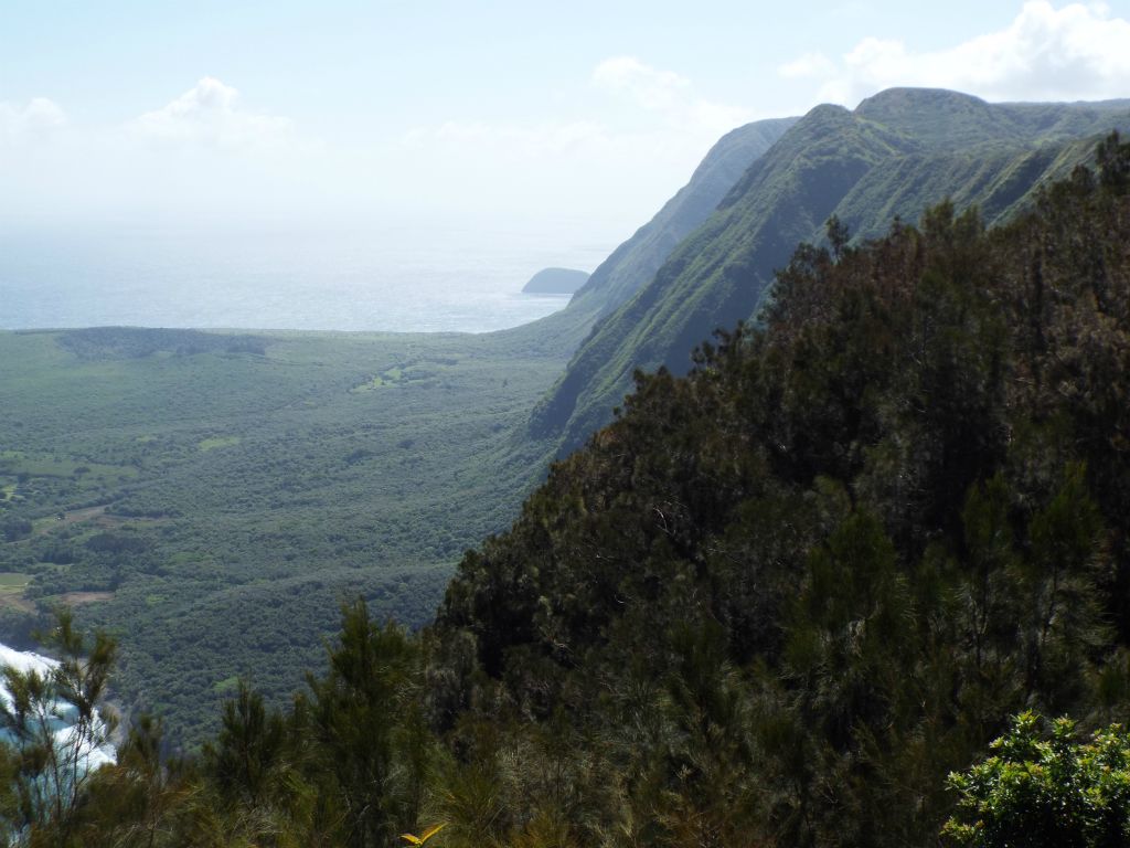 Being surrounded by towering cliffs and ocean water, there are no roads to Kalaupapa.  This viewpoint is the closest you can get by car: