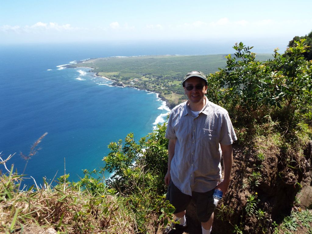 A picture of Charlie with the Kalaupapa peninsula behind him: