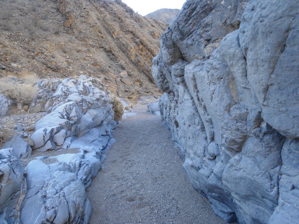 A narrow passage to walk through with a soft bottom of pure gravel: