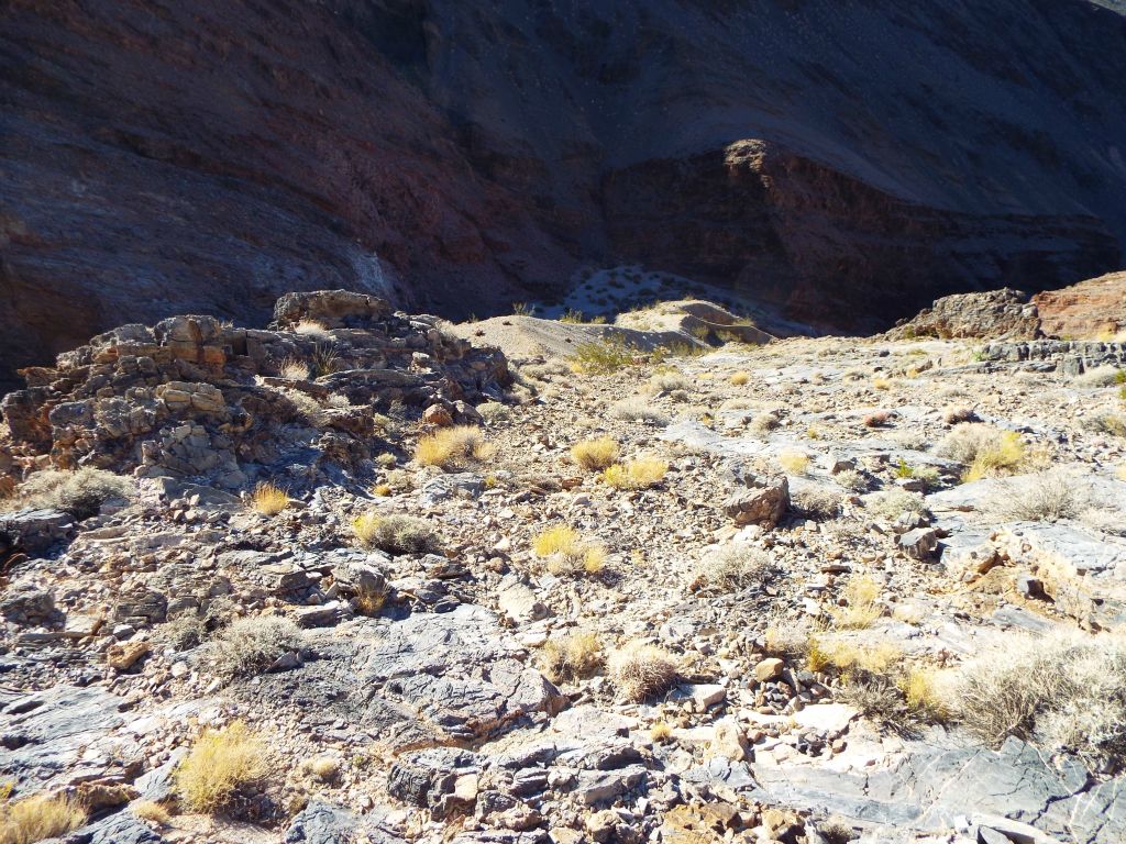 This picture shows the loose rock that must be navigated on the steep hike back down.  To the left are the sheer cliffs: