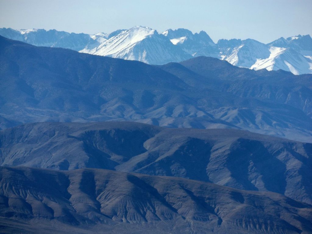 Two pictures of the snow-capped Sierras as seen behind the Inyos: