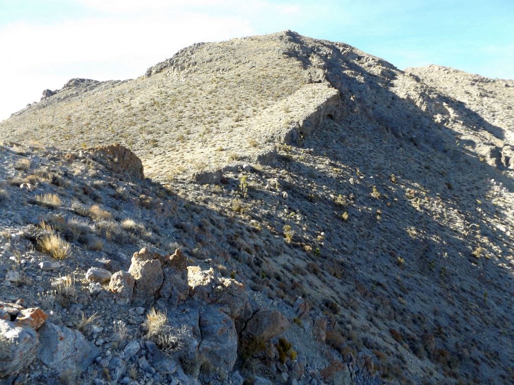 We then headed down from the summit using a more direct route to reach the canyon.  Here we have hiked down the first section and are looking back up at the summit: