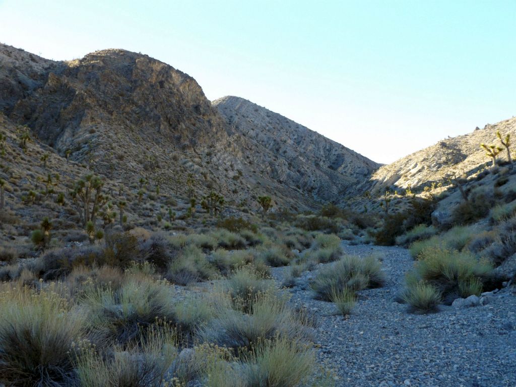 The canyon looks quite beautiful up ahead, with the rounded rock peak to the left and the diagonal sloping hillside in the background: