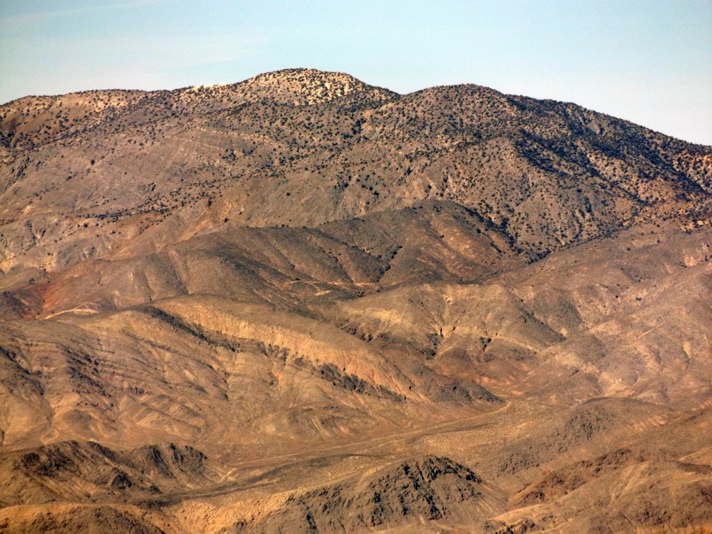 Last Chance Mountain (8,456 feet) is about 15 air miles away from P6980: