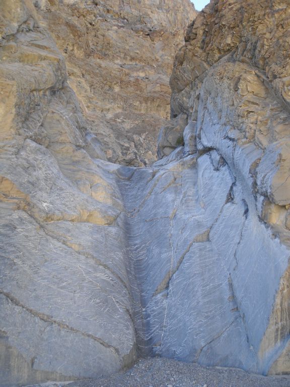 This is the 12-foot dry fall as seen from the bottom.  Don't climb down this unless you are positive you can climb back up.  There are poor handholds and footholds.  I had to stack rocks to climb it but if a friend is with you, perhaps you can get a boost: