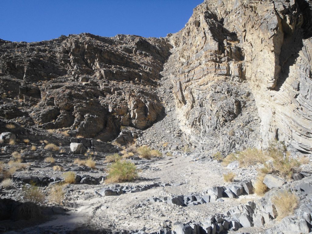The canyon walls on the right side drop a bit in height at the upper canyon mid-point.  Perhaps there is an easier way to cross back over to the east on the hike back and save some time and mileage: