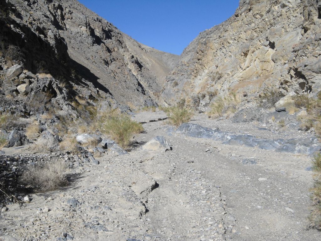 The canyon walls are still quite high but this is not an enclosed slot: