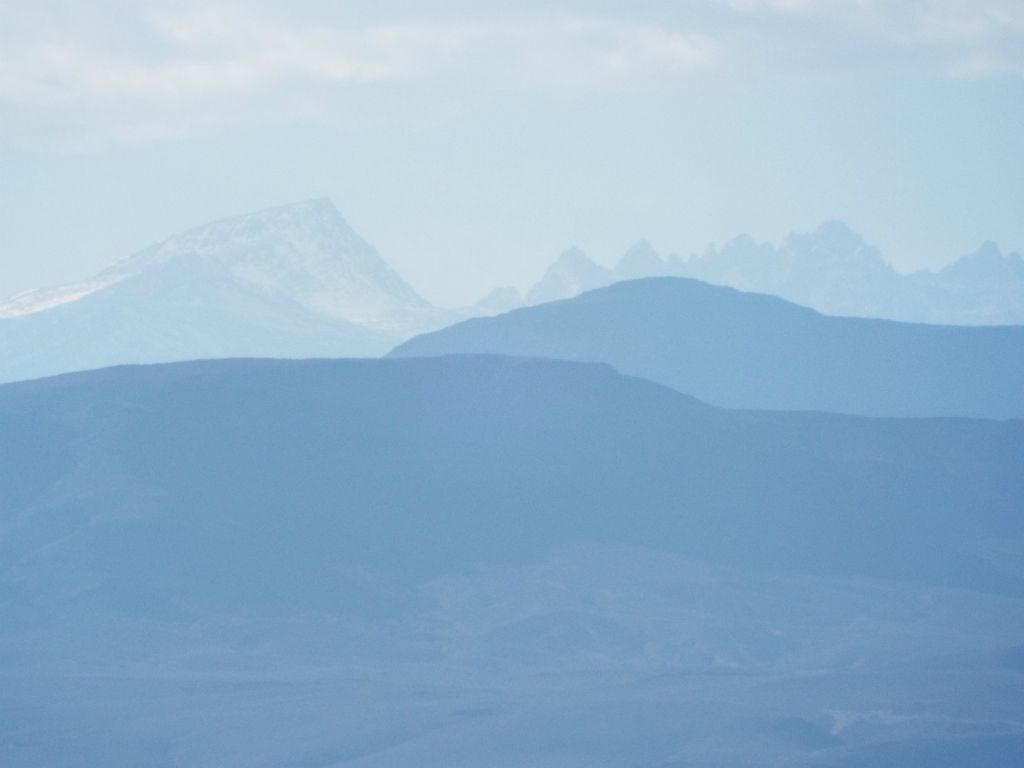 View of the Sierras from the mouth of the canyon.  If I had to guess, I would say that the left peak is Mount Langley and the right side shows Mount Le Conte with its two rocky bumps to the left of it: