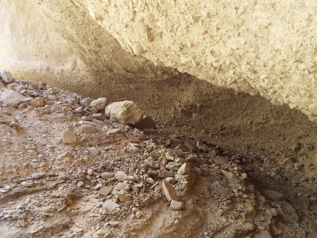 The overhang has been caused by this large undercut in the canyon wall: