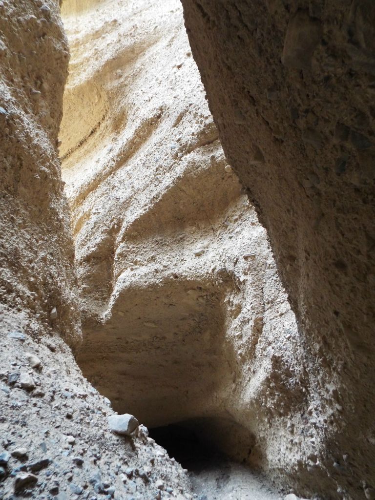 Notice the undercut cave at the bottom of the picture below the high walls: