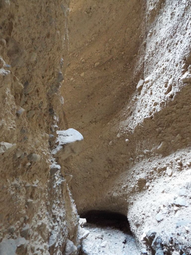 Completely enclosed within the walls of the slot: