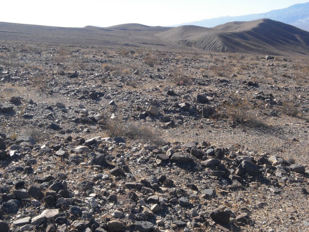 Getting there was easier said than done.  It was nonstop hiking across small drainages and through a minefield of loose rocks which are painful to walk on: