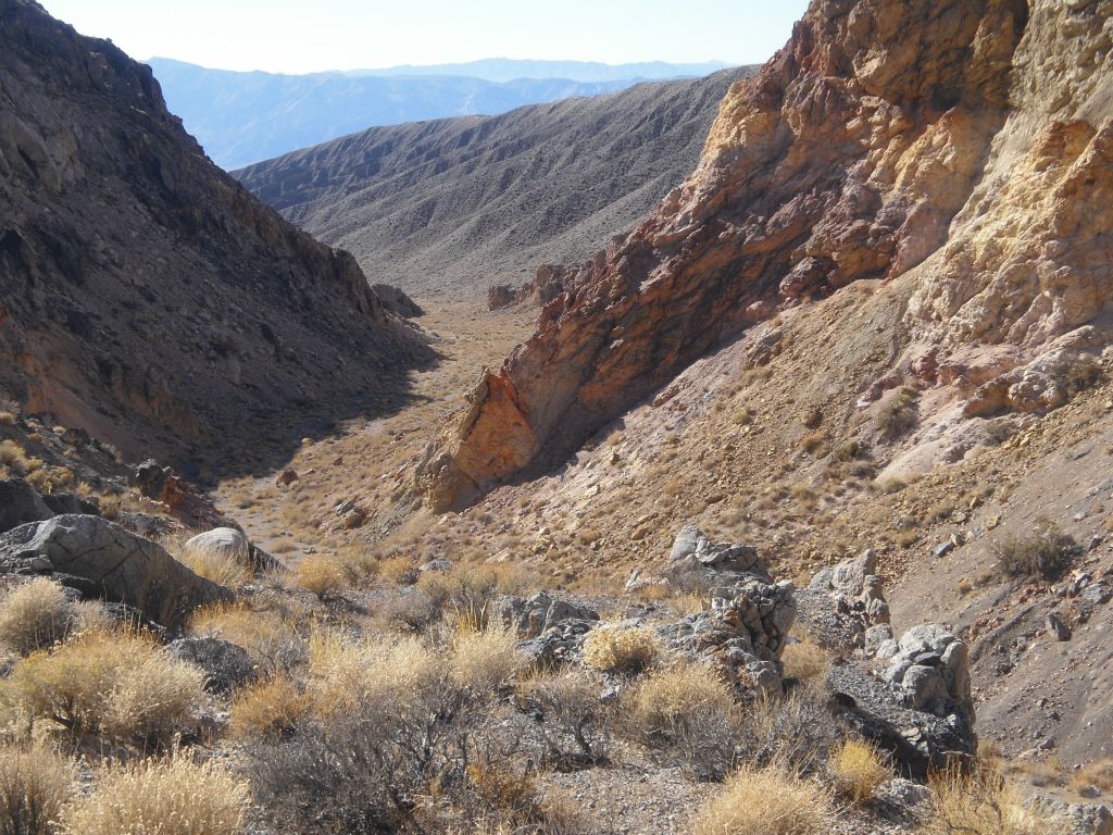 At this point, it was time to check out the potential bypass route.  I headed up the hillside before the dry fall and took this picture looking back down canyon.  This is a good spot to turn around and head back down canyon for those who are not comfortable doing treacherous bypasses: