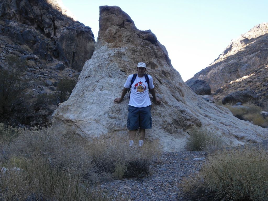 Steve pictured next to an interesting rock formation in the wash: