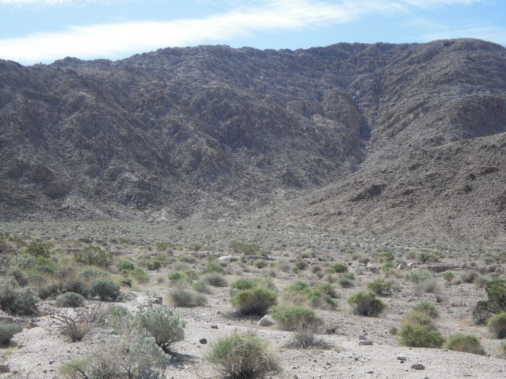 The early part of Contact Canyon with its high southern wall.  In this picture you can faintly see the steep side canyon we would hike down at the end of the day to complete our loop: