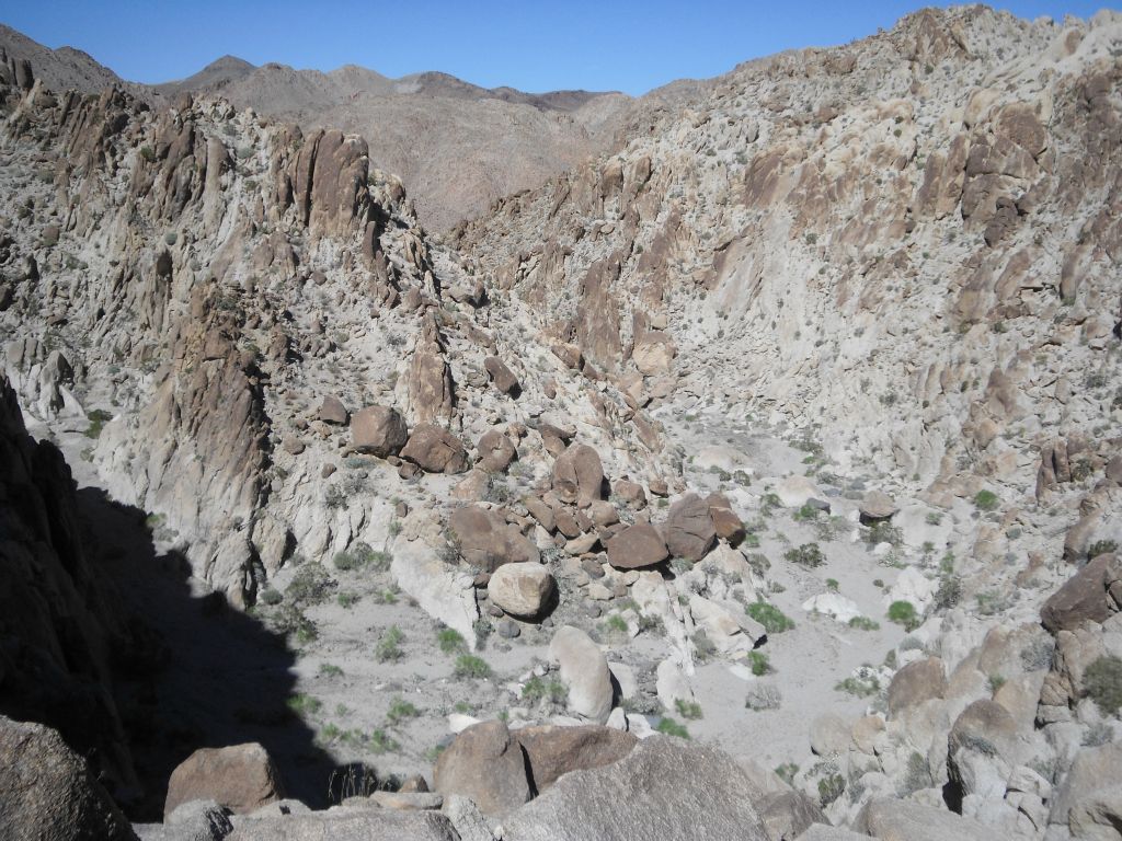 We backtracked from the 2nd dry fall and headed up a bypass to our left.  This was the view looking back down at the main canyon from the early stages of the bypass: