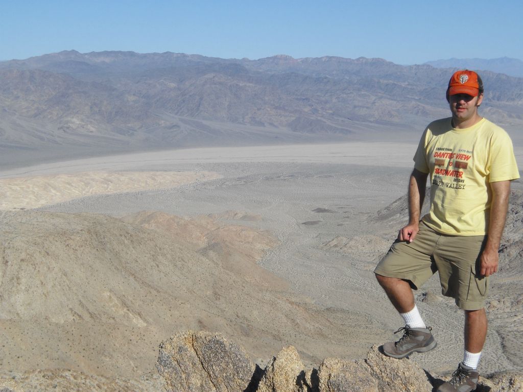 A picture of Steve on Con BM with the mouth of Granite Canyon and the Confidence Hills in the background: