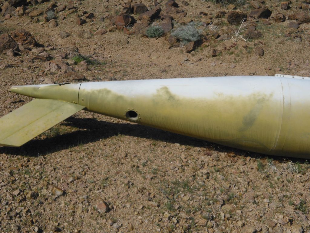 Back end of the fuel tank resting on the ground:
