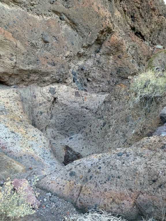 Reaching a series of polished solid rock cascades which contained breccia rock: