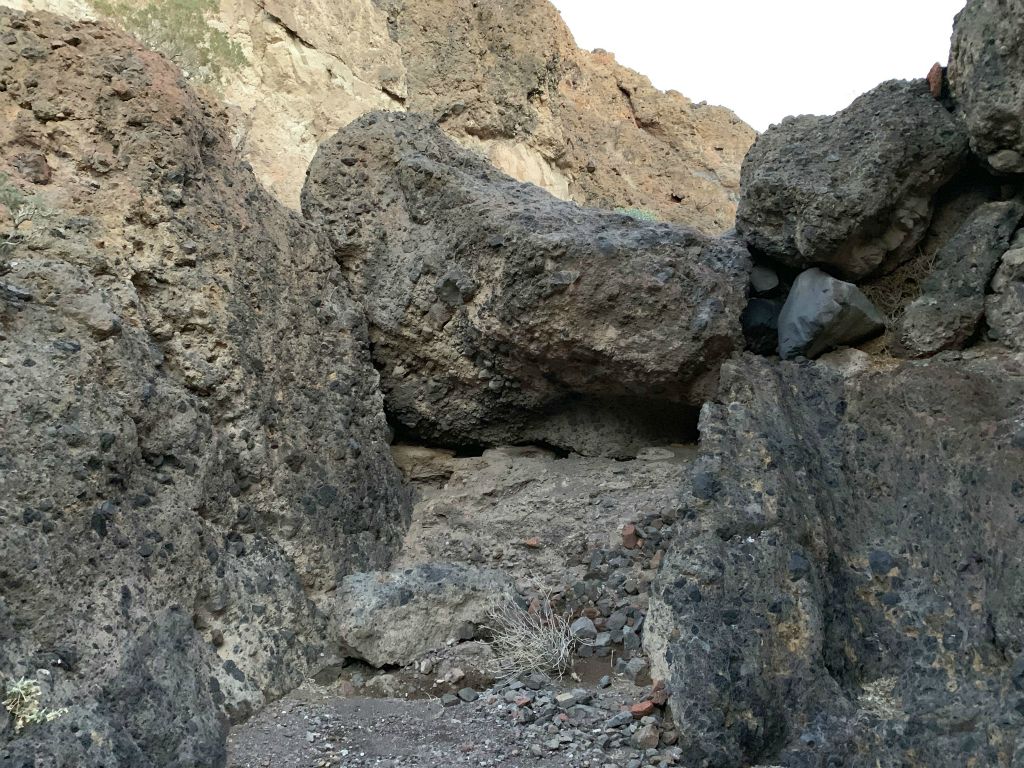 A massive boulder jam in the middle of the canyon wash: