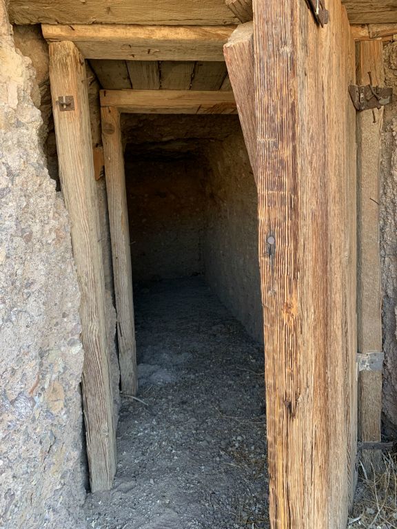 Looking inside the wooden door and door frame of the shelter: