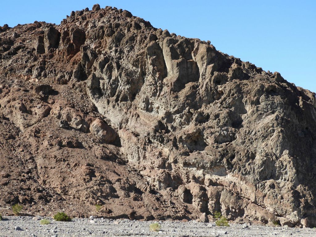 Very interesting rock shapes with some reddish colors on this hillside: