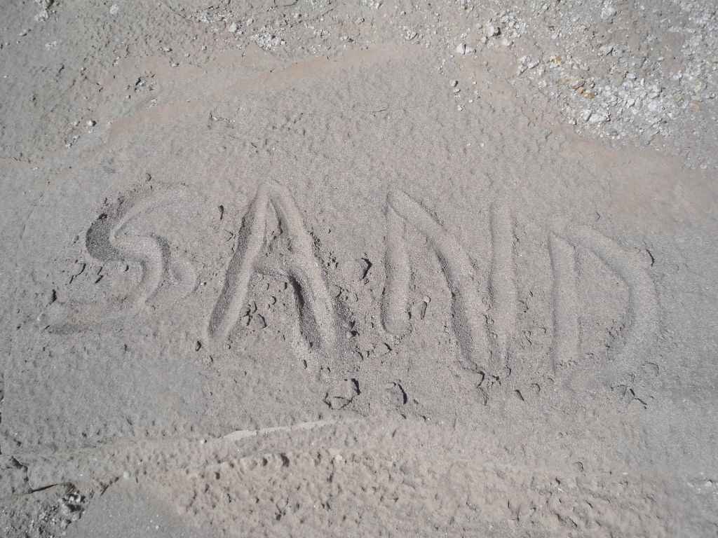Yep, that is really sand as I tested it out by writing the word into the sand with my finger.  This is when I finally knew for sure I was in the correct canyon: