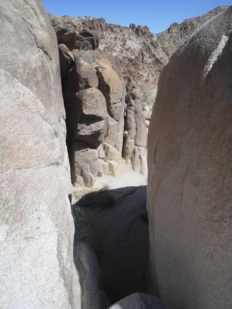These boulders are so huge that they almost look like they are forming two sides of a canyon wall: