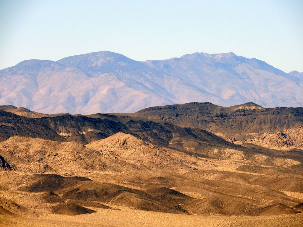 Zooming in on three very high major peaks located in the southern Panamints.  Left to right, they are Mormon BM (8,270 feet), Porter Peak (9,101 feet), and Sentinel Peak (9,634 feet):